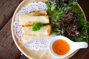 fried spring rolls on wooden table