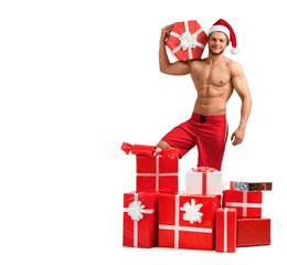 Special presents. Handsome Santa Claus holding a gift box posing in studio