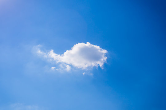single cloud in blue sky