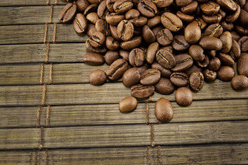 Coffee beans on vintage wooden board