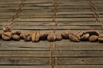 Coffee beans on vintage wooden board