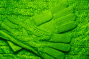 Wool sweater or scarf and gloves texture close up.
