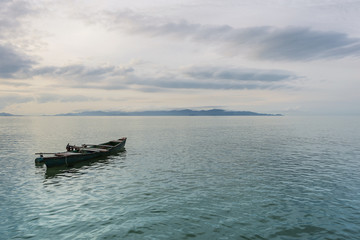 Obraz na płótnie Canvas Fishing boat at sunrise Thailand