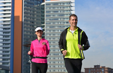 couple practicing running in the city