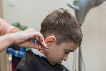 Fototapeta premium boy at barber , haircut