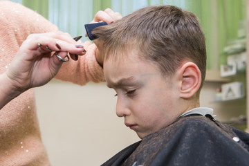 boy at barber , haircut

