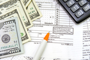 Tax forms  with pen, calculator and money