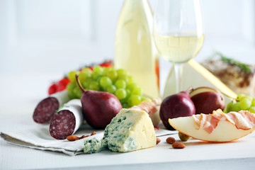 Still life with various types of Italian food and wine