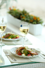 Fototapeta na wymiar Tasty salad on white served table