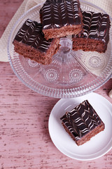 Served table with chocolate cake on wooden background