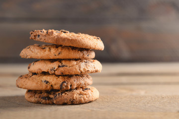 Fototapeta na wymiar Cookies with chocolate crumbs on wooden background