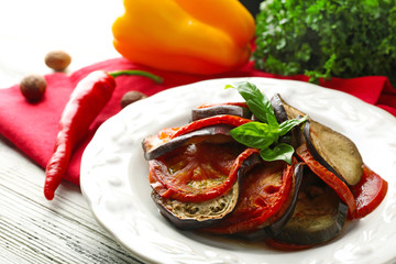 Ratatouille on plate, on table background