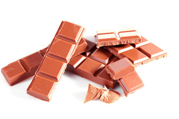 Milk chocolate pieces isolated on white background