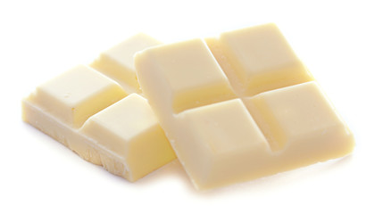White chocolate pieces isolated on white background