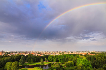 Beautiful cityscape looking over the city of Amsterdam in the Netherlands with a rainbow
