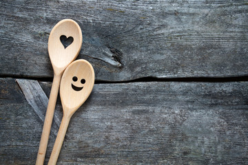 smiling wooden spoons on kitchen table