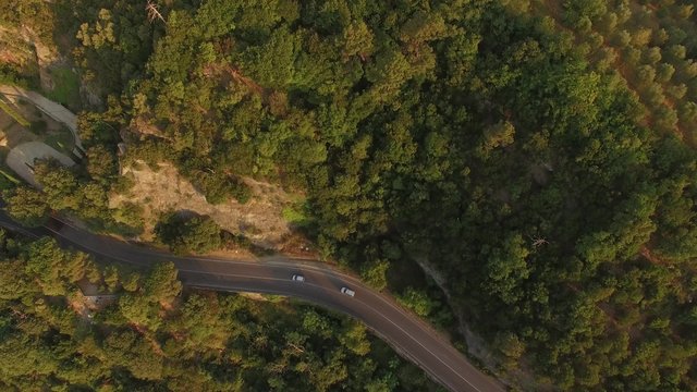 Camera flies over cars and reveals Tuscan Landscape