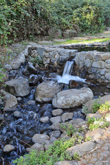 park creek with a small waterfall in the vicinity of Katzrin in