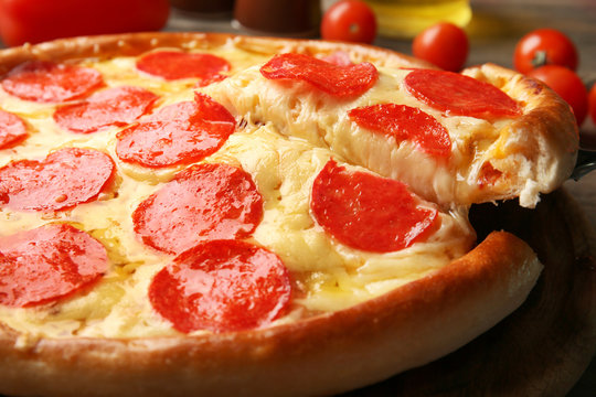 Hot tasty pizza with salami, close up