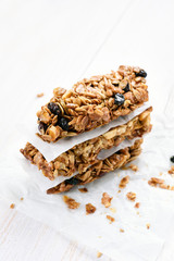 Granola bars on white wooden table