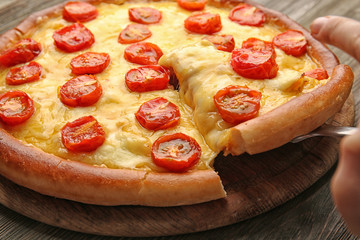 Pizza Margherita and removed slice, close-up