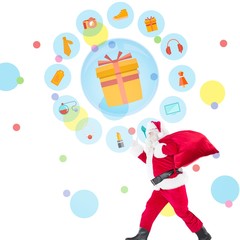 Composite image of positive santa with a sack and thumbs up