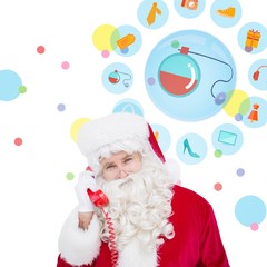 Composite image of santa claus on the phone 