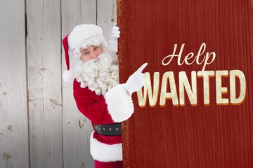 Composite image of smiling santa claus pointing poster 