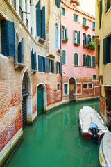 Fototapeta na wymiar Canal in Venice at sunny day. Italy. Europe. Toned image.