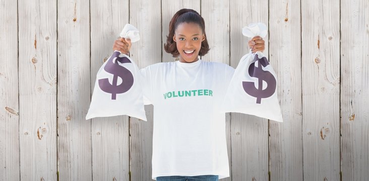 Composite Image Of Smiling Volunteer Woman Holding Money Bags 
