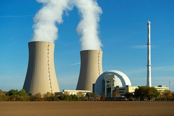 Nuclear power plant on the sky background
