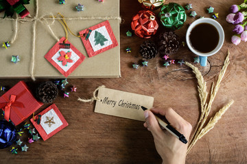 Brown gift box and coffee on old wooden background, Christmas co