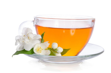 Glass cup of tea with jasmine on the white background