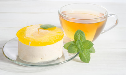 cake with tea on white wooden table