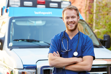 Portrait Of Male Doctor Standing In Front Of Ambulance © Monkey Business