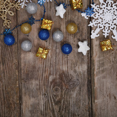 Fototapeta na wymiar Christmas decorations on an old wooden table