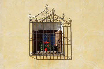 The ancient traditional window in historic medieval old town. Zuoz
