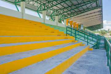 empty seat on cement grandstand