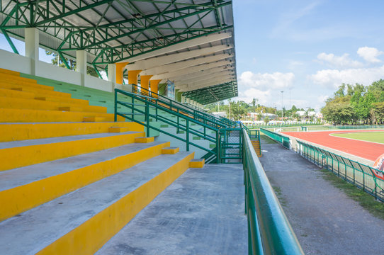 empty seat on cement grandstand
