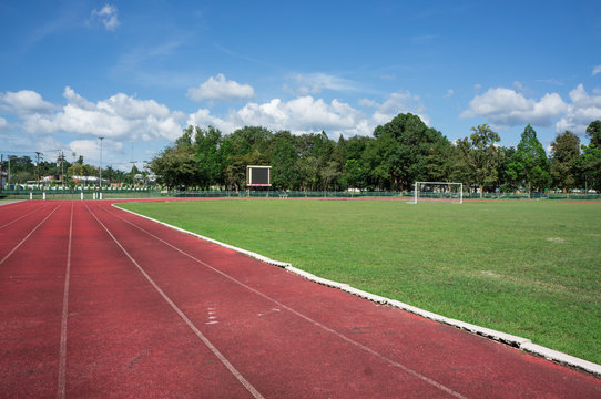 race track , football field with blue sky
