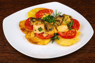Roasted salmon with potato and tomato