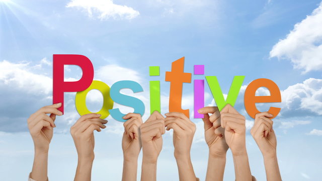 Hands holding up positive