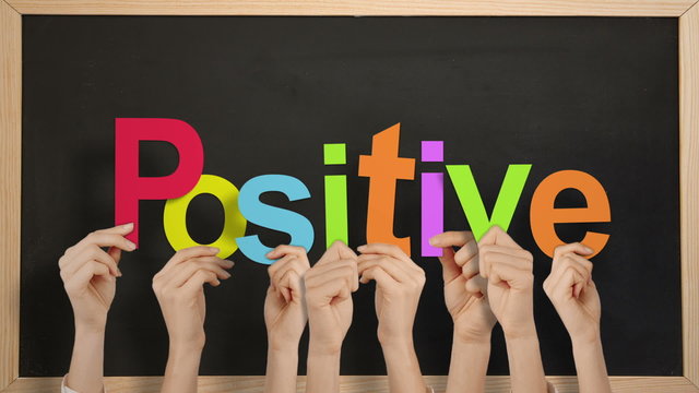 Hands holding up positive