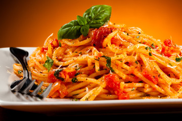 Spaghetti with meat, tomato sauce and vegetables 