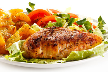 Fried chicken fillet, chips and vegetable salad 