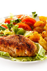 Fried chicken fillet, chips and vegetable salad 