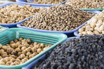 Spices and vegetables in bags at local bazaar in Osh. Kyrgyzstan