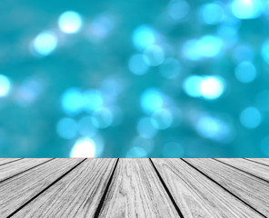 Empty Wooden Perspective Platform with Sparkling Abstract Blue Blur Bokeh used as Template to Mock up for Display Product