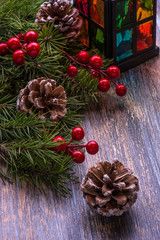 Christmas card with tree decorations and glass candlestick  on th wooden background. Marry Christmas