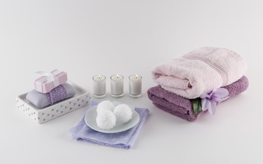 Obraz na płótnie Canvas Luxury Bath Soap, Bath Bombs and Towels With Candles
